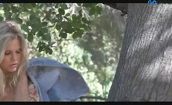 Teasing Nymph Under Blossoming Tree with Alluring Charms